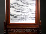 an image of a picture frame with a marble in it
