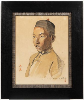 portrait of a young man in a yellow shirt and a black hat