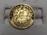 an image of a gold coin on a white surface
