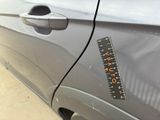 a sticker on the side of a car with a ruler on it