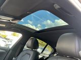 a view of the sunroof from inside of a car