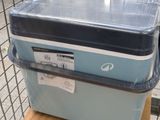 a blue cooler sitting on top of a wooden box
