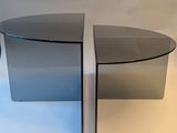 an image of a glass coffee table with a curved glass top