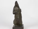 a bronze statue of a woman holding a baby in her arms