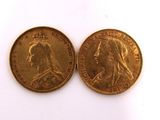 two gold sovereigns, one of which is a woman and the other of which is a man