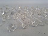 a lot of clear glass knobs sitting on a table