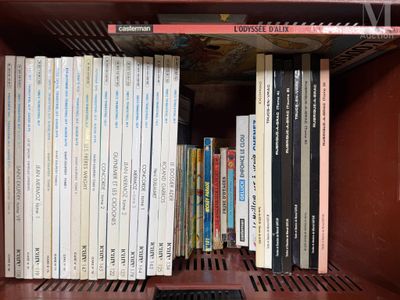 many books that are on a shelf in a book case