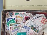 a box full of stamps with a lot of stamps in it