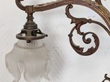 a light that is on the wall next to a lamp