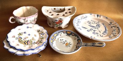 many different types of dishes and cups on the table