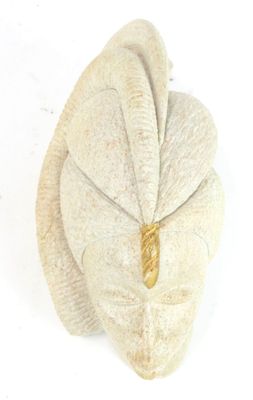 a white towel with a gold ring on top of it