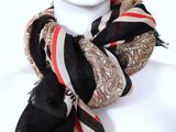 black, white, and red striped scarf on a mannequin head