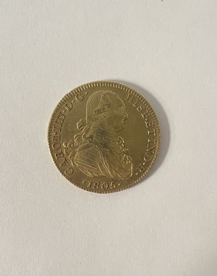 l'image d'une pièce d'or sur laquelle figure le portrait d'un homme