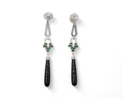an image of a pair of earrings with black and white stones