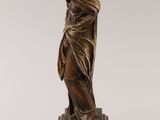 a bronze statue of a woman with a veil on her head