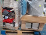 two boxes of clothing on a pallet in a warehouse