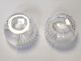 two clear glass vases sitting on a white surface