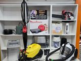 a yellow and black vacuum sitting on top of a white shelf
