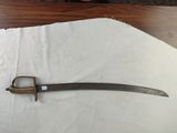 a knife that is laying on top of a piece of paper