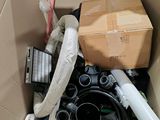 a cardboard box full of assorted items in it