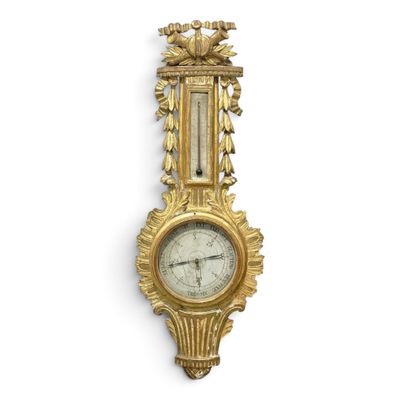 an image of a gold clock mounted to the side of a wall