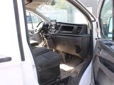 a white van with the door open and the driver ' s seat down