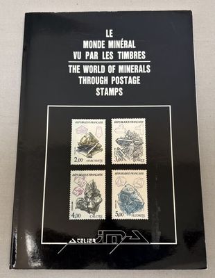 a black book with four stamps on it sitting on a table