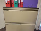 a lot of files on top of a filing cabinet