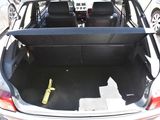 the back of a car with its trunk open and a bottle in the trunk