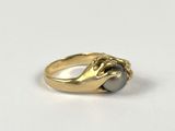 an image of a gold ring with a pearl in the middle