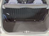 a trunk of a small car with the back seats down