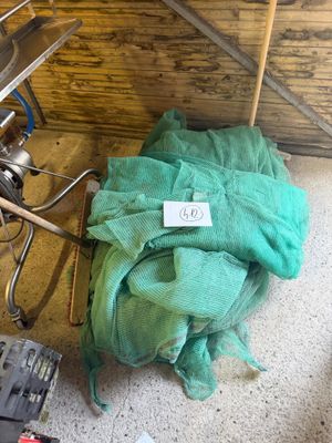a green cloth on the floor next to a stove