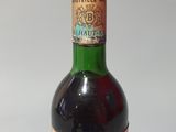 a bottle of wine that is sitting on a table
