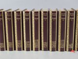 eight books of the bible are lined up on a white surface