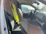 a yellow safety vest sitting in the back seat of a truck