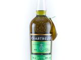 a bottle of whisky with a green label on a white background