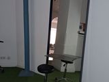 a chair and a mirror in a room