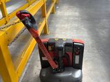 a machine that is sitting on the floor in a warehouse