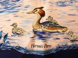 a picture of a table cloth with a picture of a duck and ducklings