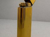 a gold lighter that is sitting on a table