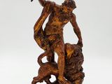 an image of a statue of a man with a sword and a lion