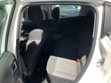 a car that has the door open and the back seats down