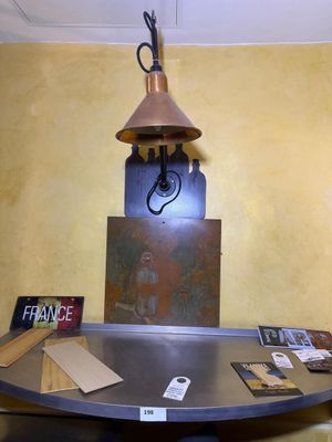 a table with a lamp on top of it in a room
