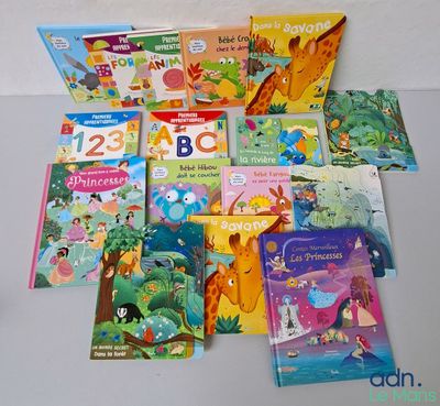 a lot of children ' s books that are on the table
