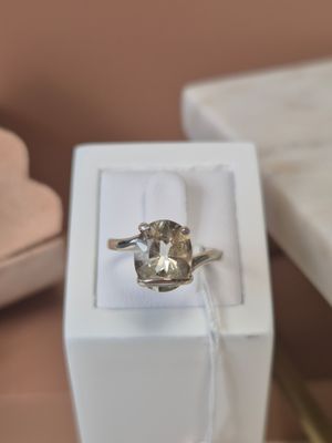 a ring that is sitting in a box on a table
