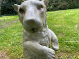 a statue of a dog that is standing on its hind legs