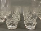 many glasses that are sitting on a table