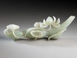 a white vase with a dragon on it sitting on a table