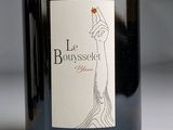 a bottle of wine sitting on a table with a label on it