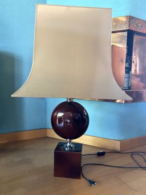 a lamp that is sitting on a table in a room